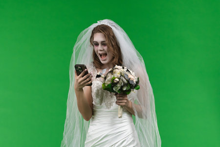 Dead Bride in a Wedding Dress on a Green Backgroundの写真素材