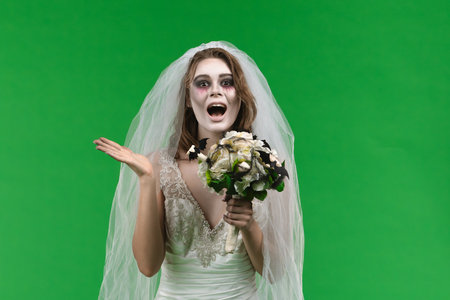 Dead Bride in a Wedding Dress on a Green Backgroundの写真素材