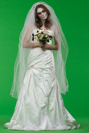 Dead Bride in a Wedding Dress on a Green Backgroundの写真素材
