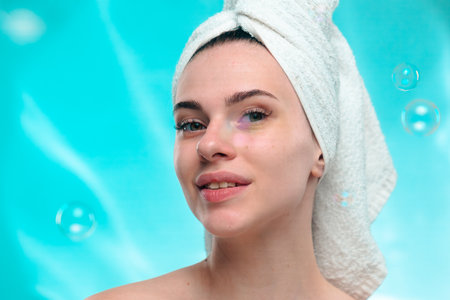 Woman with Towel on Head Smiling Surrounded by Bubbles