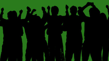 Black silhouettes of a group of people cheerfully celebrate their victory against a green chroma key background. Minimalist contrast and modern visual composition, mockup.の写真素材