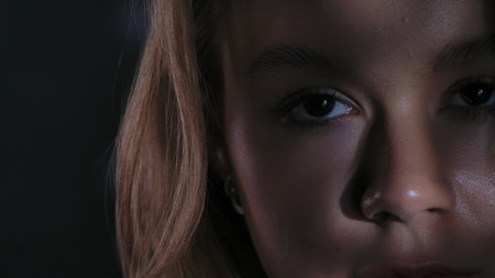 Close Up Portrait of a Woman Face with Dramatic Lightingの写真素材