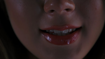 Close up of Woman Lips with Glossy Red Lipstickの写真素材