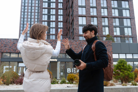 Two People Having Conversation in Urban Setting