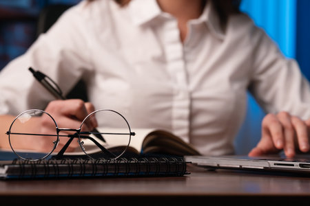 Close Up of Hands Typing on Laptop Keyboardの写真素材