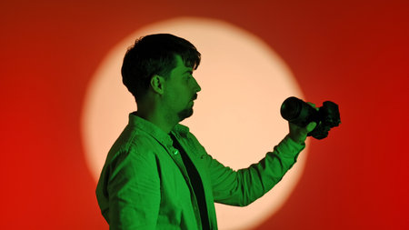 Backstage Photographer Capturing Image with Creative Lighting Setup