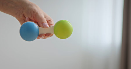 Colorful Baby Rattle with Blue and Green Endsの写真素材