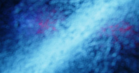 Abstract background featuring a blend of blue color in a soft, blurred pattern, evoking a sense of...