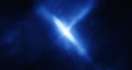 A mesmerizing abstract display of blue light rays forming a dynamic, radiant pattern against a dark...