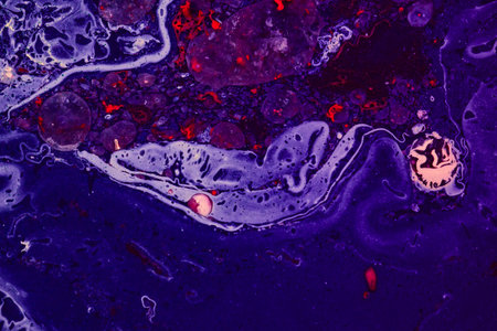 Abstract background of purple, red and white paint divorces, streaks and particles suspended in...
