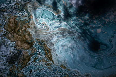 Abstract background of blue, brown and white marble paint divorces floating on liquid surface....