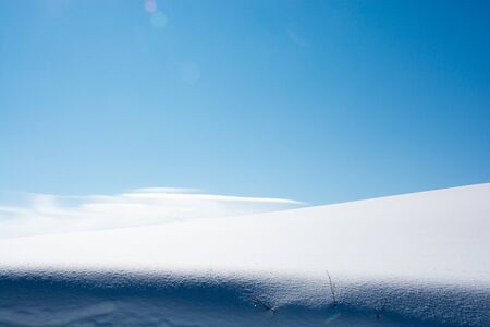 Snow field and blue sky