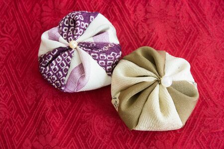 Japanese traditional toys on red clothの写真素材