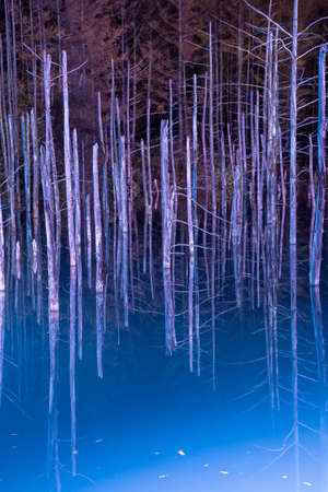 Illuminated fantastic autumn blue pond in Bieiの写真素材