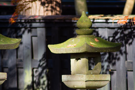 Nightlight made of stone in the autumn garden of Japanの写真素材