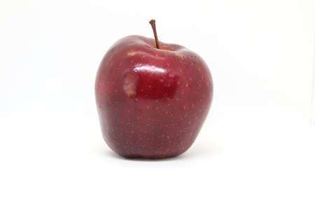 Apples with white spots on the skin, placed on a white backgroundの写真素材