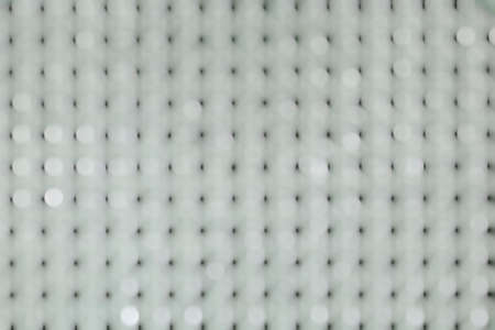 Abstract white bokeh on a white background and black dots scattered throughout the area.の写真素材