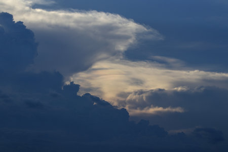 undulating clouds with blue sky unusually stormy weather Dark gray clouds and bright white clouds contrast.の写真素材