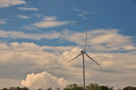Windmills stand still because nature is calm and has enough power.