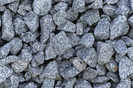 Close-up of small gray and white rocks. Overlapping becomes the background image.の写真素材