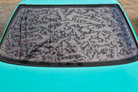Old car windshield with scratches and cracks, closeup of photo.の写真素材