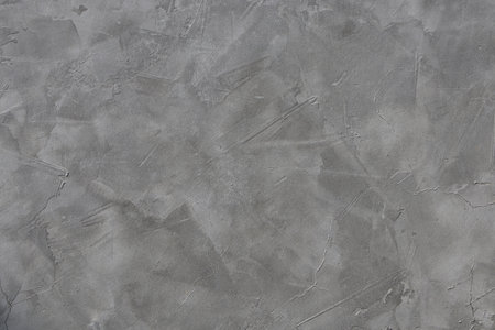 The abstract background image comes from a gray concrete wall.の写真素材