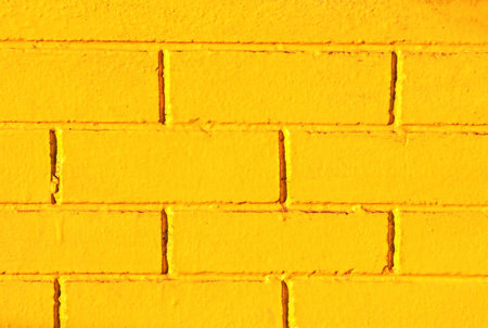 Build the house walls with small bricks and paint the walls yellow.の写真素材