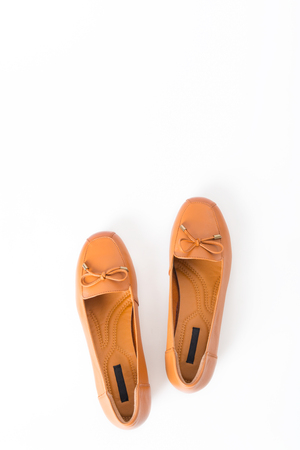 Beautiful vintage Pair of fashion woman leather shoes with top view profile and copy space, isolated on white background.の写真素材