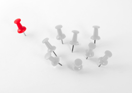 Red pin separated from white pins group.の写真素材