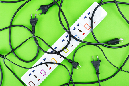 Messy of electrical cords plugs and wires unconnected electrical power strip or extension block ...