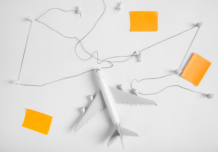 Preparation for Traveling concept, push pin, string, paper noted on white background with copy space.の写真素材