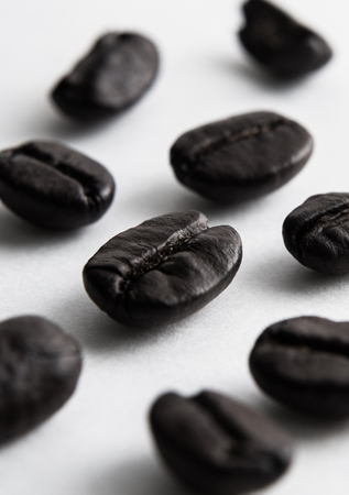 coffee beans selective focus on white background.の写真素材