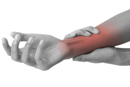 woman holding her beautiful healthy wrist  and massaging in pain area black and white color with red highlighted, Isolated on white background.の写真素材