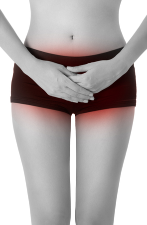 woman posing perfect healthy body shape and hand holding stomach, period  pain in area with black short pants and long beautiful legs, black and white color with red highlighted, Isolated on white background.の写真素材