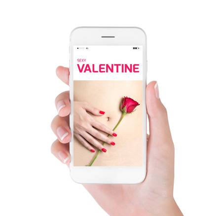 Woman using her smart phone searching hand red nails holding red rose on sexy belly. valentine and sexual concept, Isolated on white background.の写真素材