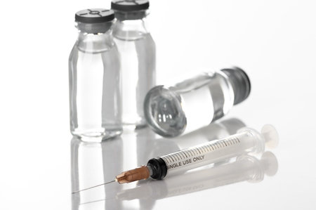 Medicine vials and syringes in the laboratory- Health Beauty and medical concepts- Isolated on white backgroundの写真素材