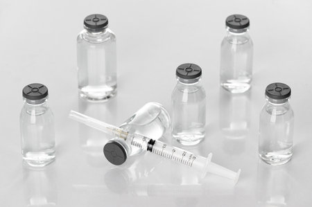Medicine vials and syringes in the laboratory- Health Beauty and medical concepts- Isolated on white backgroundの写真素材
