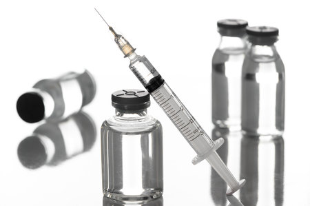 Medicine vials and syringes in the laboratory- Health Beauty and medical concepts- Isolated on white backgroundの写真素材