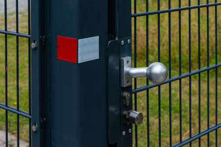 Ball-shaped metal handle on the door. close up