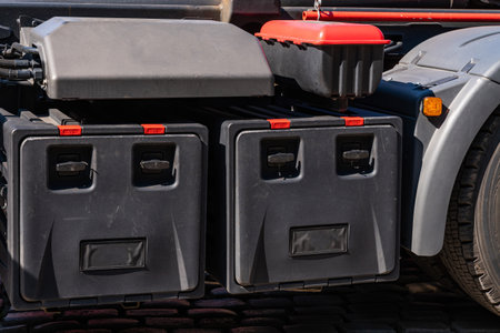 Black toolboxes under the back of a big truck. Closeup.の写真素材