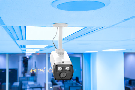 Modern security camera in business office workplaceの写真素材