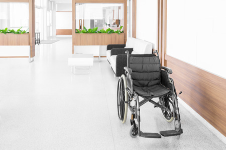 NAKHONRATCHASIMA, THAILAND - November 15, 2014: Empty wheelchair parked in hospital hallway, November 15, 2014 in Nakhonratchasima, Thailand.のeditorial素材
