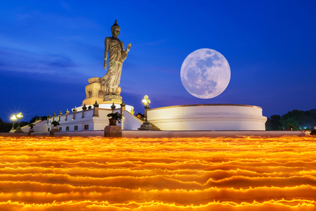 Colorful walk with lighted candles in hand around temple to the Buddha with full moon at Phutamonthon Park, Nakhon Pathom, Thailandの写真素材