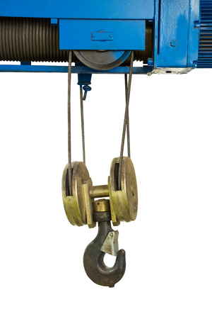 Industrial crane hook hanging with sling in factory isolated on white backgroundの写真素材