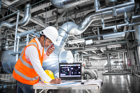 Electrical engineer working at control room of a modern thermal power plantの写真素材