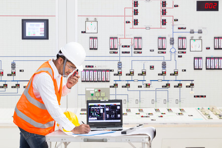 Electrical engineer working at control room of a modern thermal power plantの写真素材