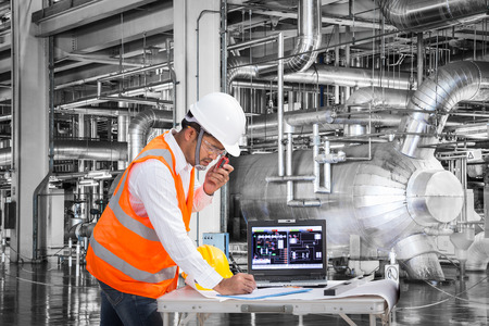 Electrical engineer working at control room of a modern thermal power plantの写真素材