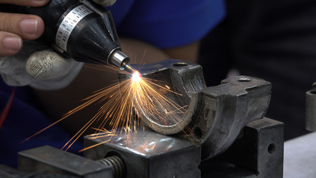 Close up handle grinding machine for polishing metal of automotive partsの写真素材