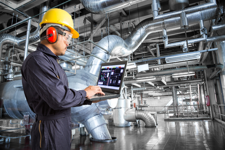 Engineer using laptop computer in the factoryの写真素材