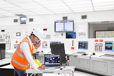 Electrical engineer working at control room of a modern thermal power plantの写真素材